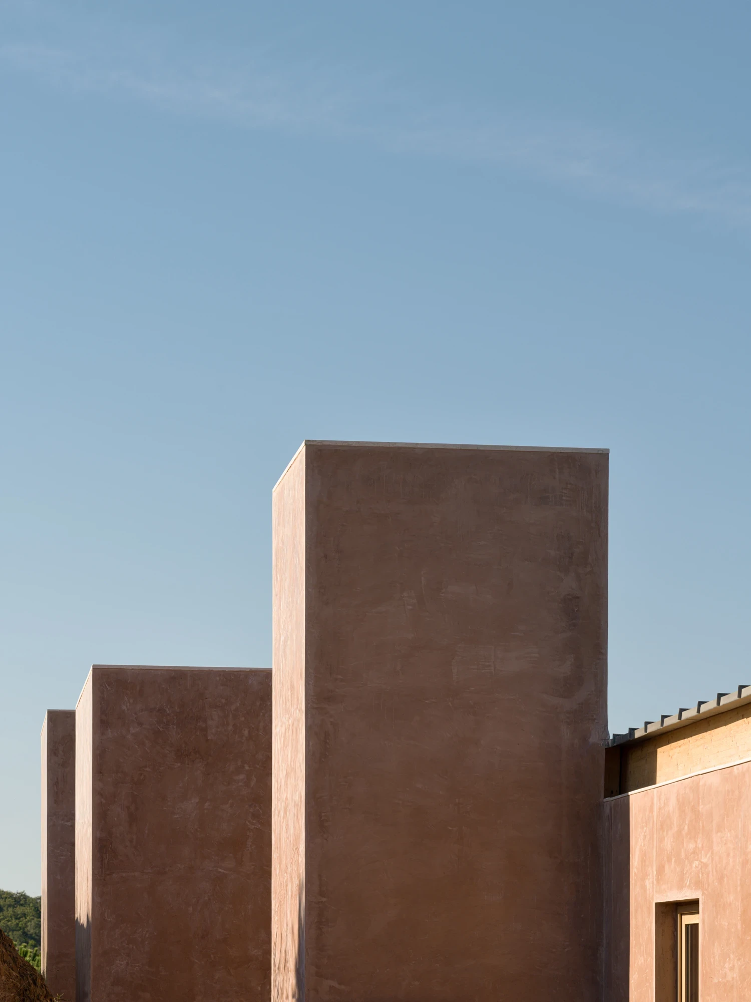 Monolithic earthen forms rising into the sky