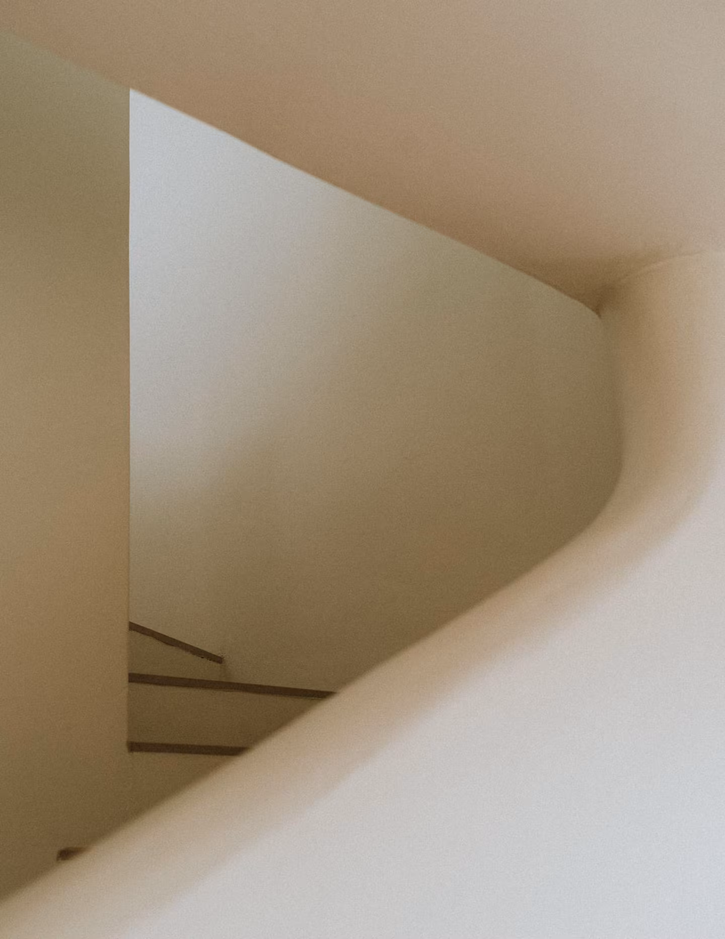 Curved white stairwell