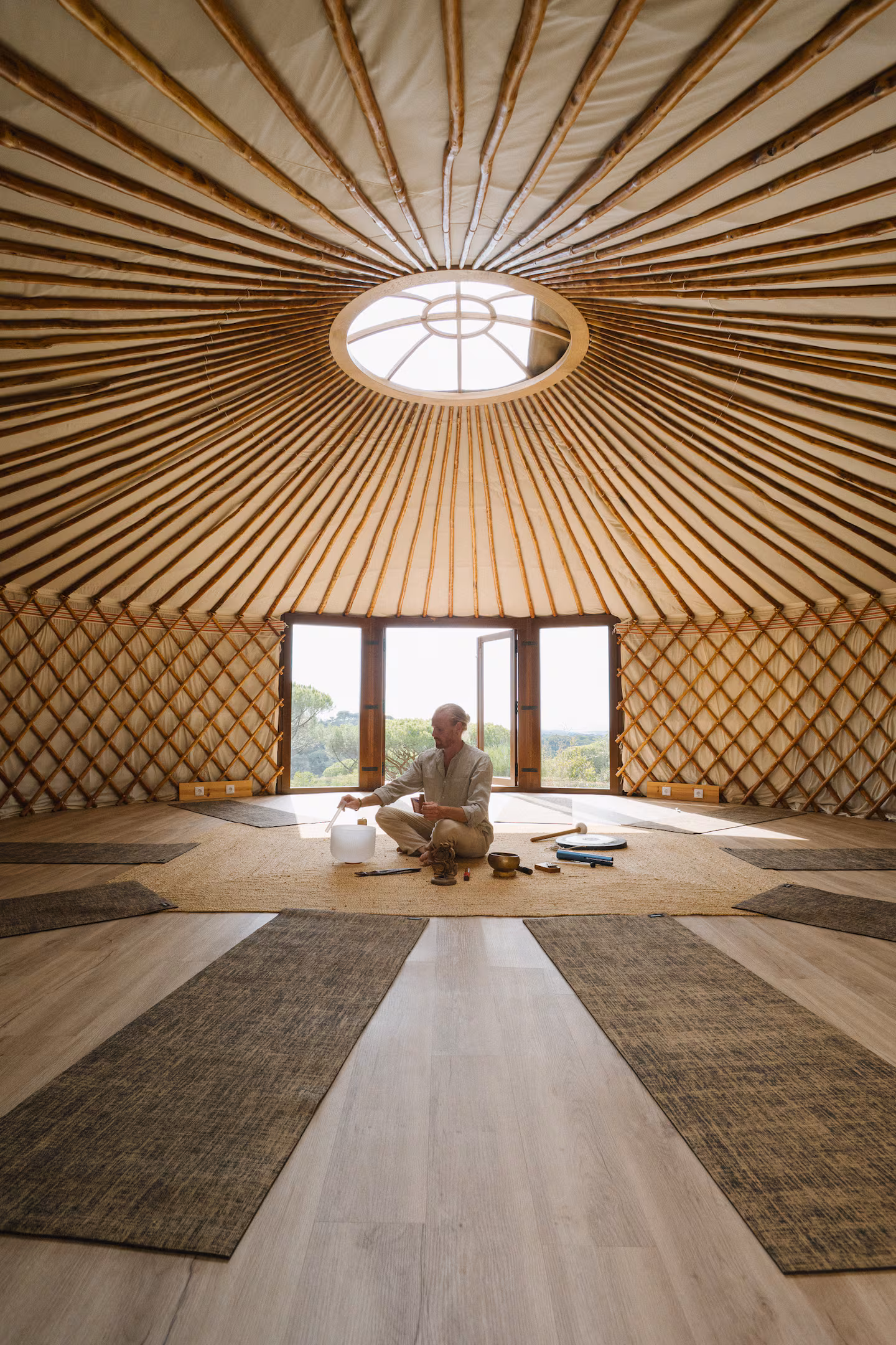 The yurt interior, sound bath beneath the oculus